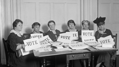 A picture of National League of Women Voters hold up signs reading, 'VOTE', Sept. 17, 1924. Millions of women voted in 1920 and 1924, but in a lower proportion than men.