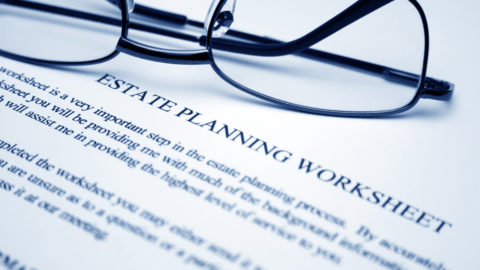 Estate planning worksheet with a pair of glasses on top