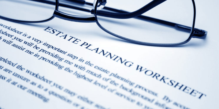 Estate planning worksheet with a pair of glasses on top